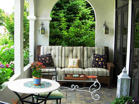 Covered terrace provides perfect outdoor setting rain or shine.