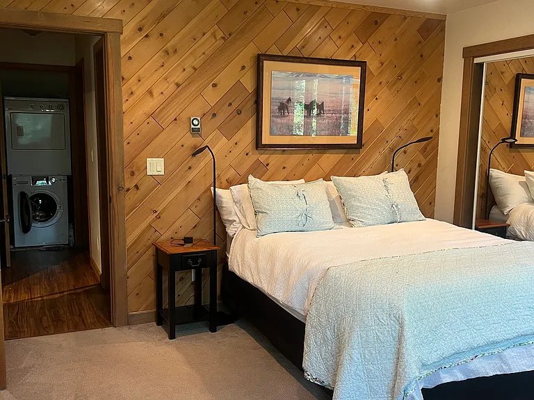 First queen bedroom off hallway of family room
