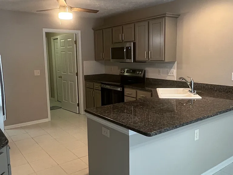 Kitchen with new cupboards and appliances. Granite countertops.