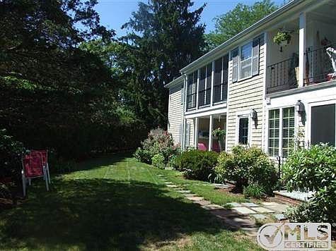 Rear view of building with second entrance to this lovely yard.