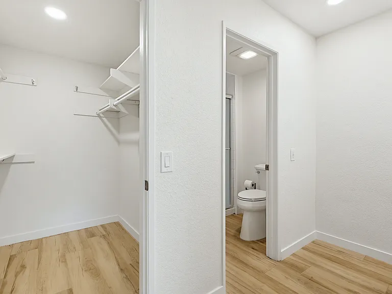 Primary bedroom walk in closet