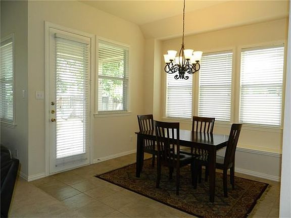Breakfast area with sitting built in bench and lots of windows for natural light.