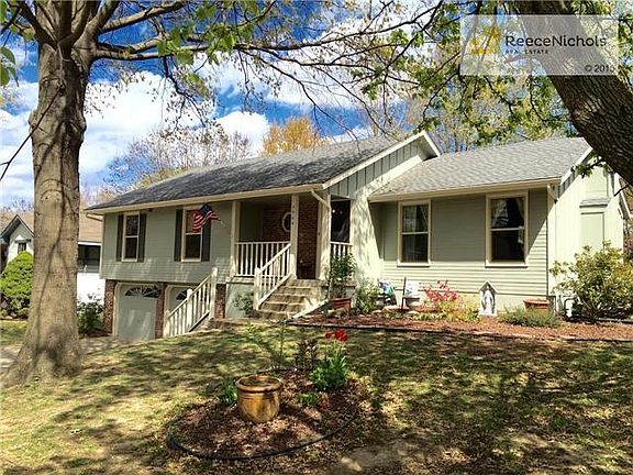 Side view of the home which has new paint and  new windows