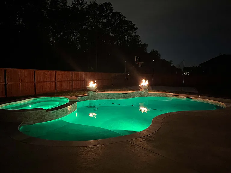 18,000 gallon pool 
10 person hot tub 
3 feet to 9 feet deep