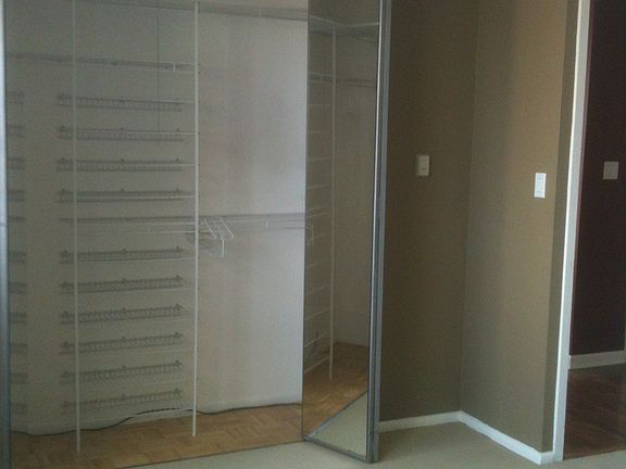 BEDROOM CLOSET WITH BUILT INS.