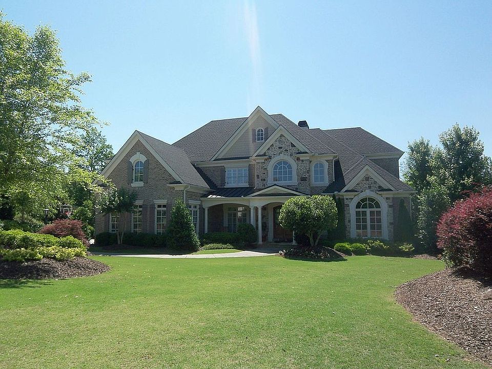 Professionally landscaped with privacy in mind.