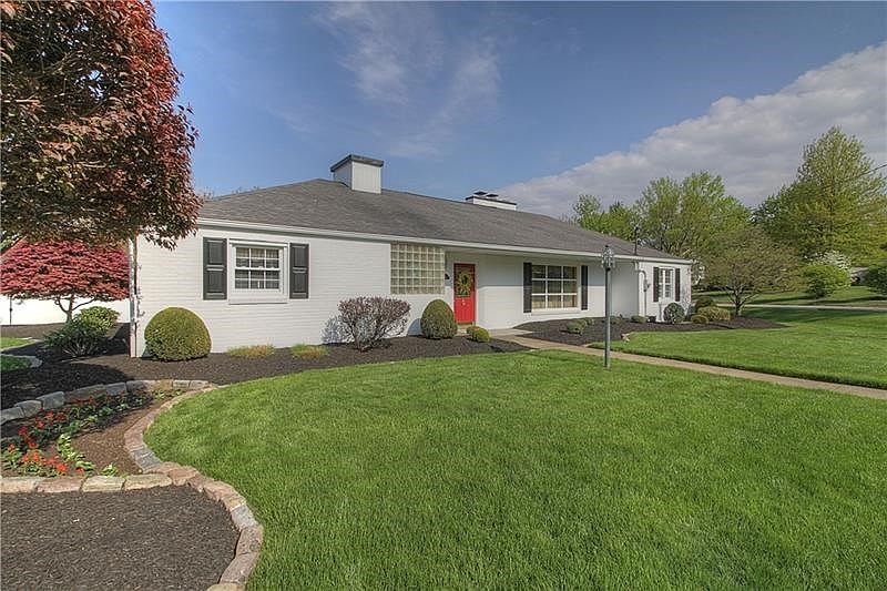 Curb appeal at its finest.  Professionally landscaped and meticulously maintained, you are sure to to fall in love with this bri