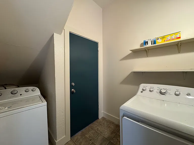 Laundry room with full-size washer and dryer