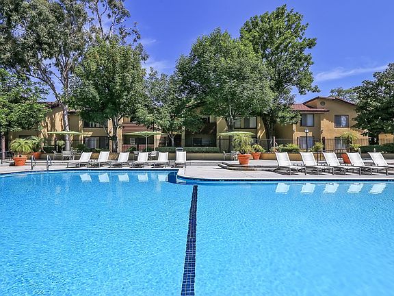 Lounge on the sundeck beside our outdoor pool
