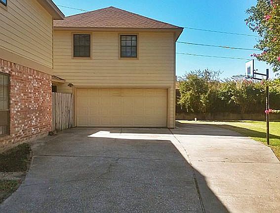 Detached garage w/ bonus room and full bath above. Garage also has large insulated workshop in back 