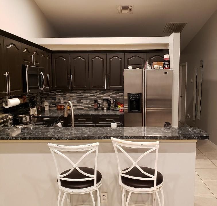 Beautiful modern open kitchen. (Everything that's on the counters is now removed)