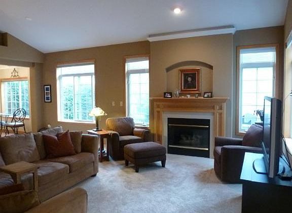 Living area with lots of windows and gas fireplace