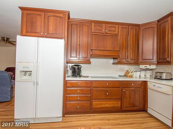 Kitchen fea new flooring and oversize Corian sink