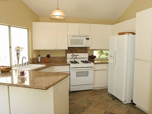 Bright kitchen with Granite countes and slate floors