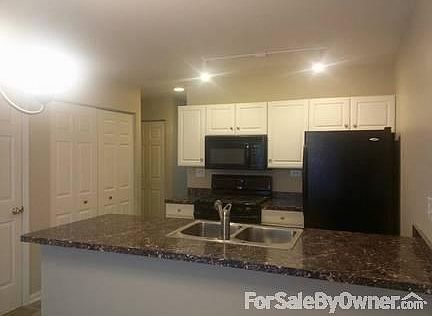 Kitchen : Fully remodeled kitchen with custom counter and tiled eating area