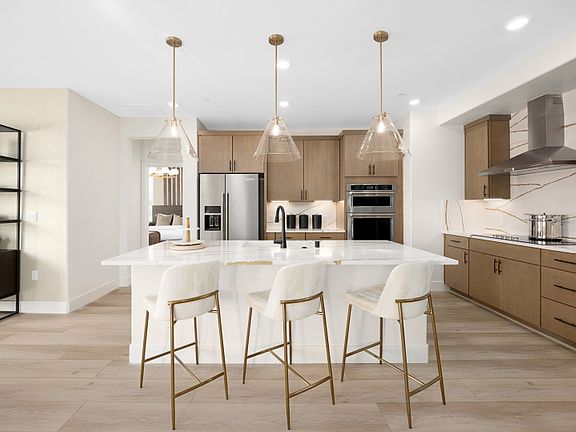 Open kitchen leading into inviting dining area