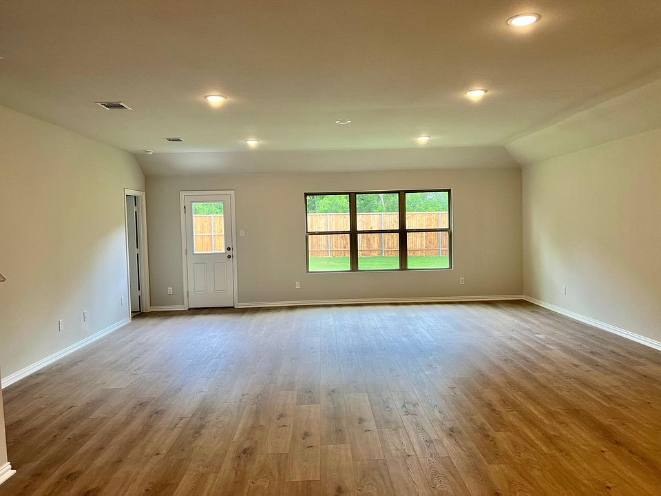 Big Open Living with affluent natural lights and wooden feel vinyl plank flooring
