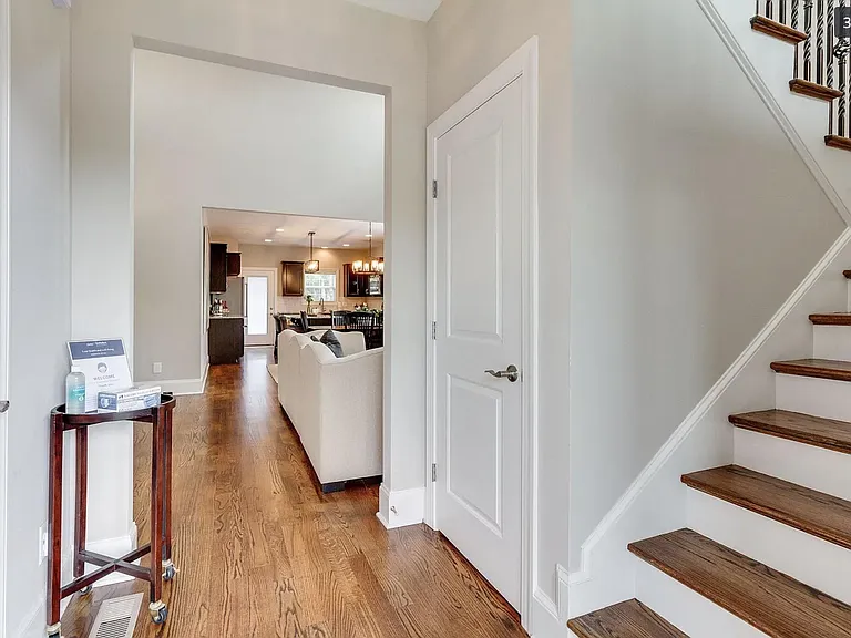 Front entry with half bath to the left and stairs to second floor on the right.