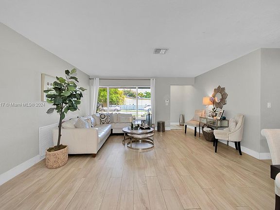 AA generous sized living area as you look to the foyer entrance.