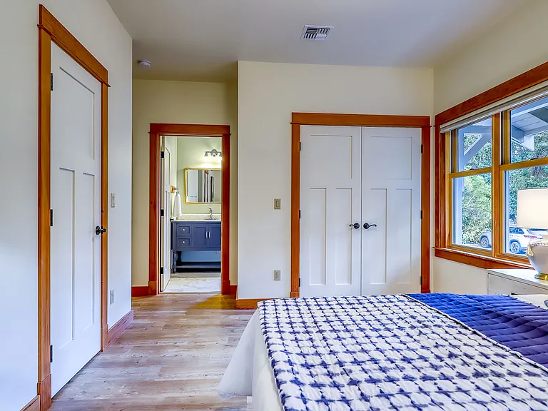 Master Bedroom looking toward en suite bathroom, two closets