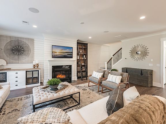 Gathering Room with fireplace. - Model Representation