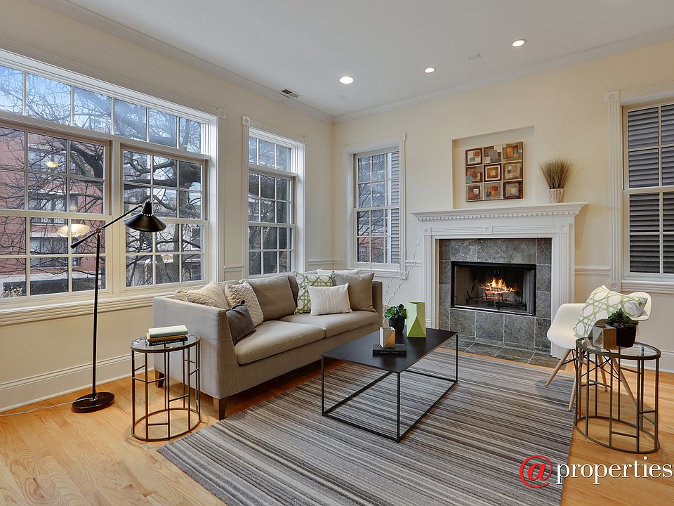 Living Room has Gas Fireplace with Stone Surround