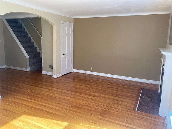 Living room, looking into dining room & toward upstairs