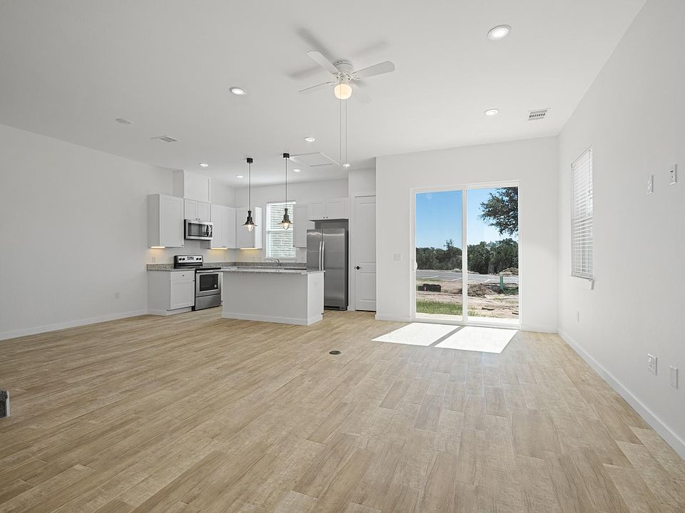 First floor as you walk in, with open kitchen, dining, and living space.