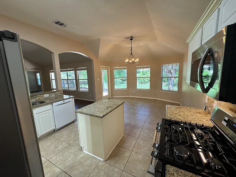 Kitchen overlooking breakfast area and living room