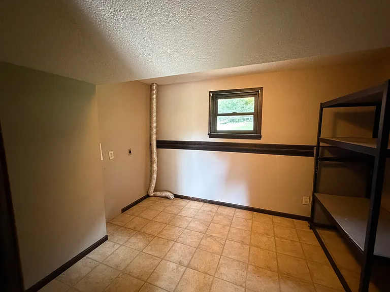 Whoa this is the laundry room! What a great space! It's larger than most bedrooms.