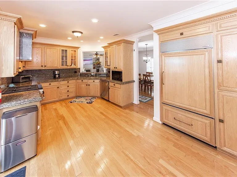 Super large, hardwood kitchen, with ultra-high end WOLF and Sub Zero appliances.
