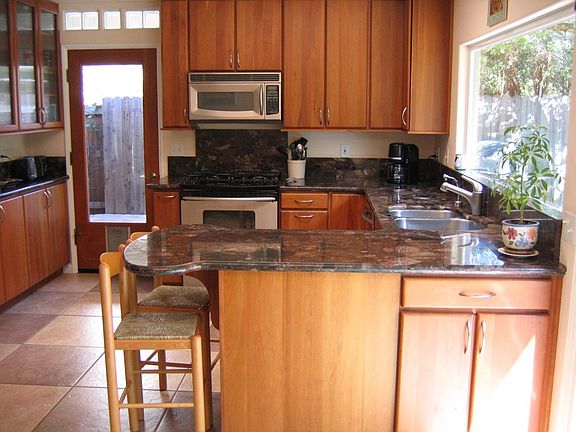 Kitchen sink looking out to backyard and patios