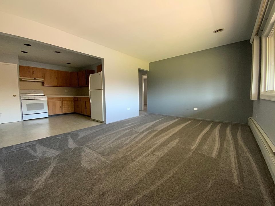 Living Room - Brand New Carpeting and Paint! Large E-insulated windows lets you enjoy second story views even from the kitchen, thanks to an open floor plan. Sunlit and internet, cable ready this space begs to be enjoyed.