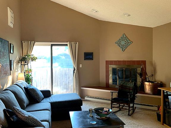 Large living room with wood-burning fireplace