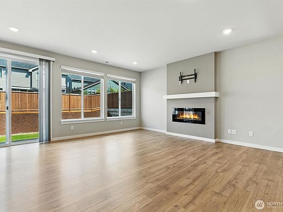Open concept floor plan is perfect for today's lifestyle. The wall of windows bring the outside in.>