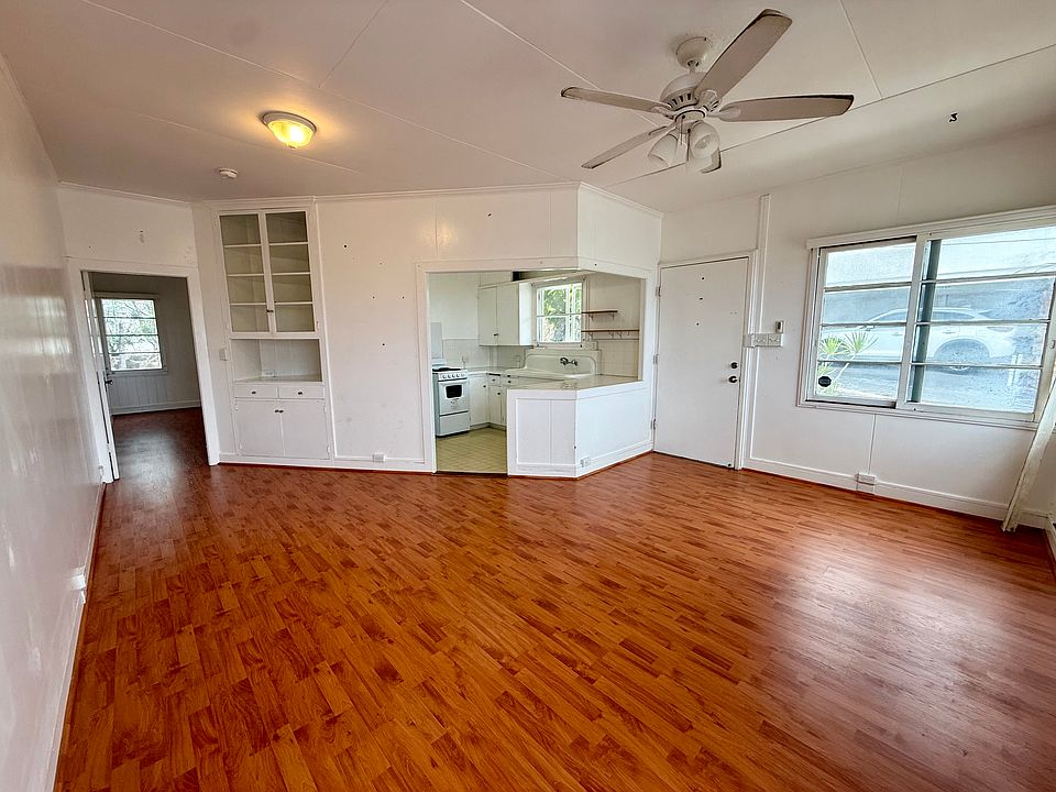 Inviting living area with a functional layout connecting seamlessly to the kitchen and bedroom.