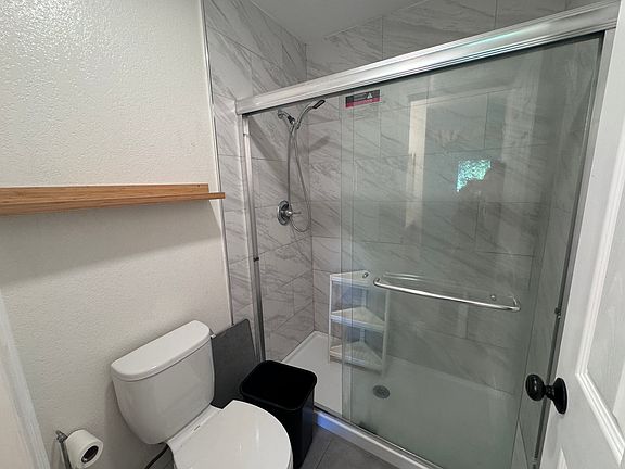 the shower area of the first master bedroom