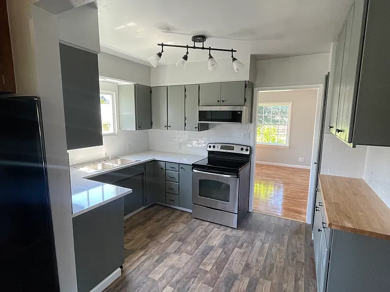 Kitchen: New countertops, dishwasher, sink and faucet (see updated sink picture). Under cabinet lighting, additional storage added with butcher block cabinets.