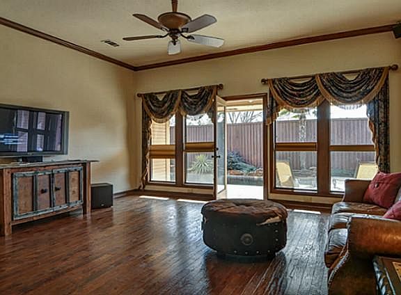 Great Room is Light & Bright! Wall of Windows + French Door to Covered Patio & Pool!