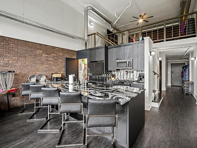 Kitchen comes with 5 leather high top chairs.