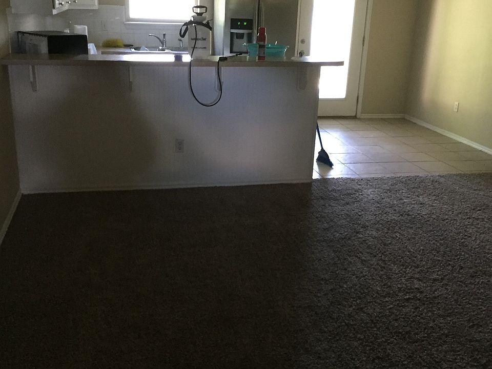 There is a bar between the kitchen & living rm. and living a