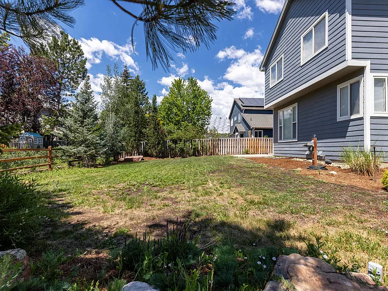 This additional view highlights the size of the backyard and the versatility of the outdoor living space.