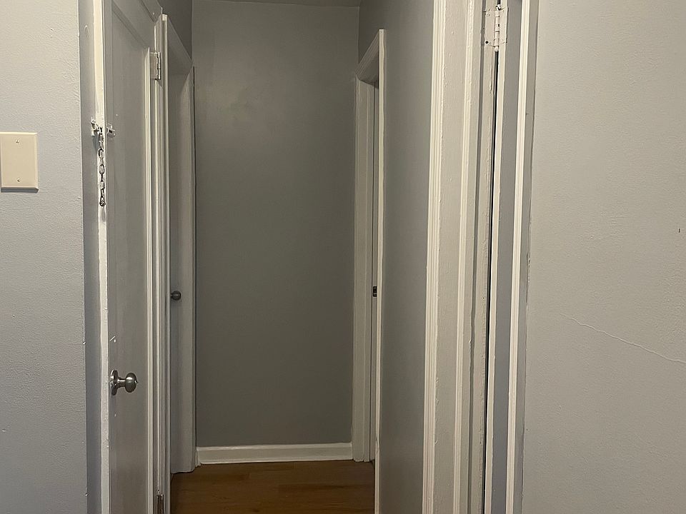 Entry door to the left bathroom to the right both bedroom doors are at the end of he hallway
