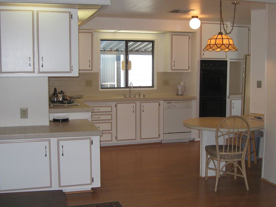 Spacious Kitchen, laminate wood flooring, updated cupboards, plumbing ect...