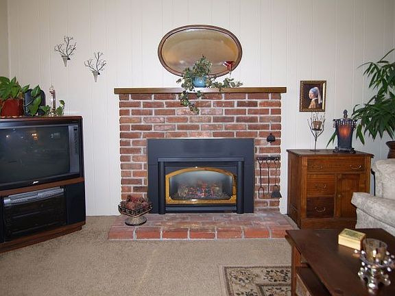 Living Room with gas fireplace and views