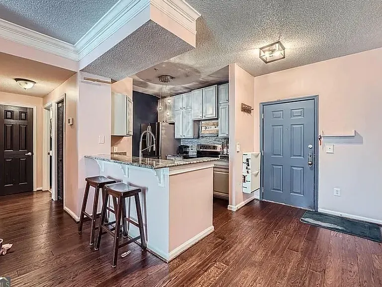 Hallway has a utility closet on the right and a large linen closet between the bathroom (r) and bedroom (l).