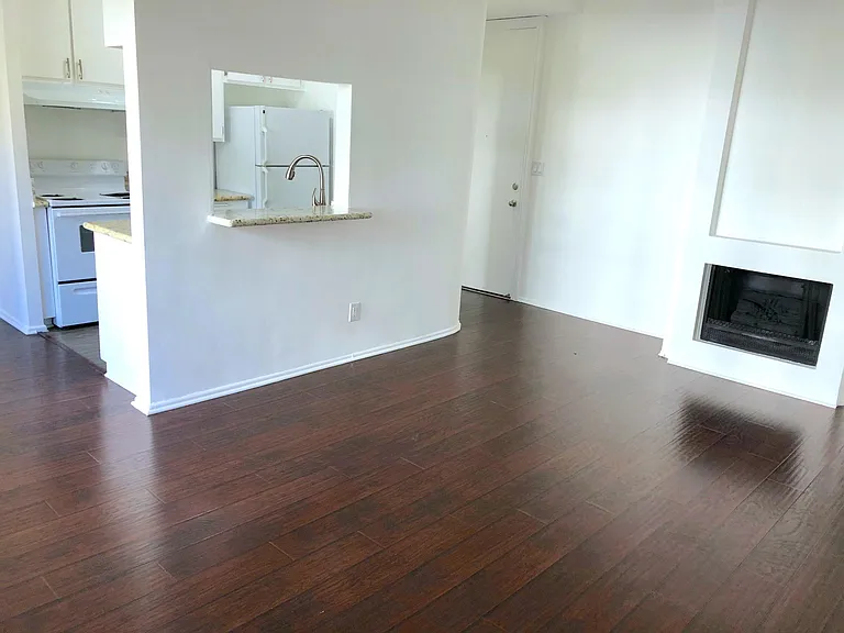 Beautiful flooring and faux fireplace.