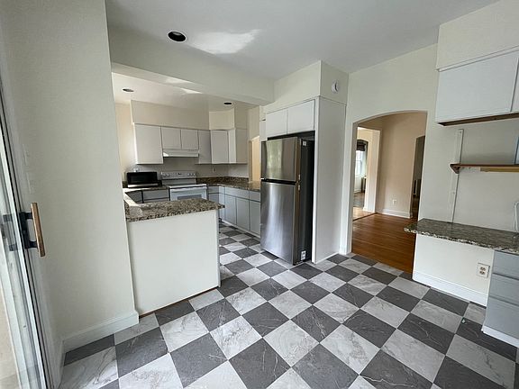 Kitchen with area for a small table and a coffee nook.