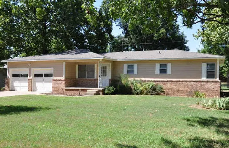 View of home from front yard -Nice Jenks School home - Two car garage - Two auto doors
