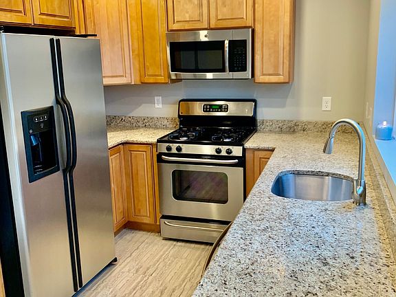 Brand new kitchen; solid wood cabinets, granite countertops, stainless steel appliances and oversized picture window